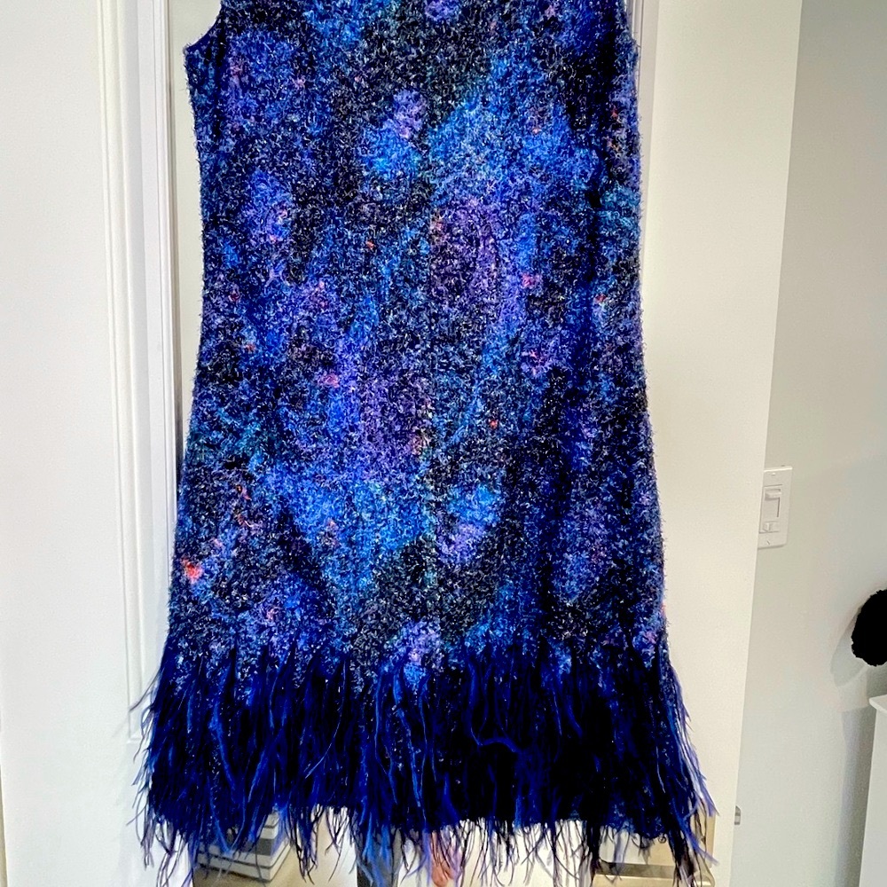 gorgeous cocktail dress with feathers at the bottom